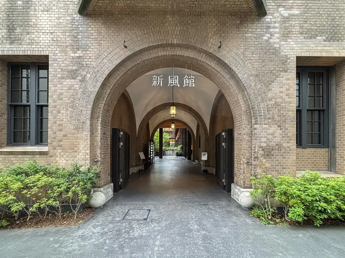 The brick facade and arcade of the former Central Telephone Office housing Ace Hotel Kyoto