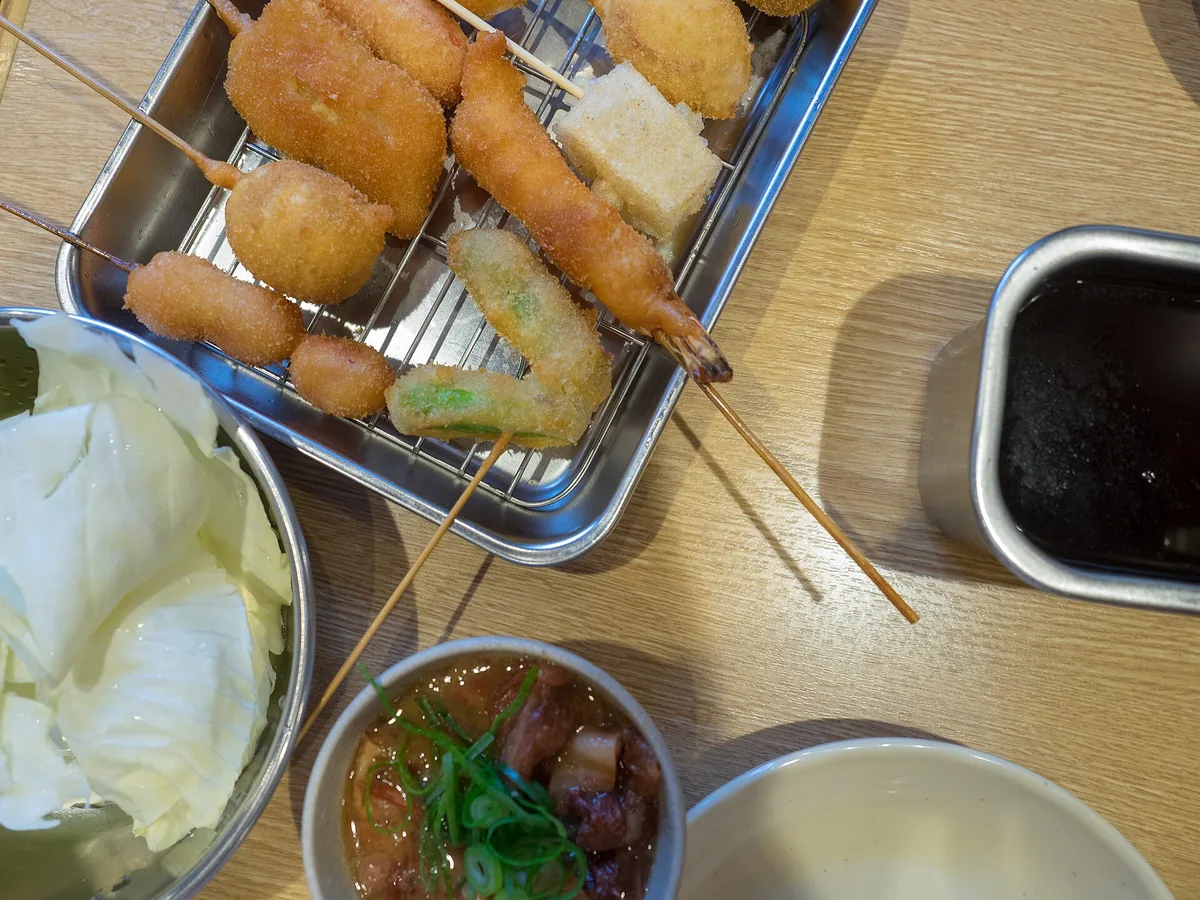Skewers frying behind the counter at Kushikatsu Daruma, Shinsekai
