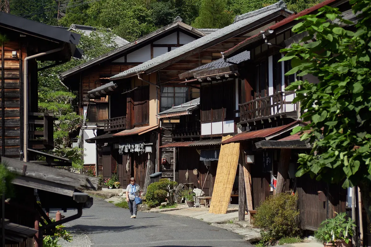 A narrow lane of wooden nagaya houses and small shops in Nakazakicho, Osaka