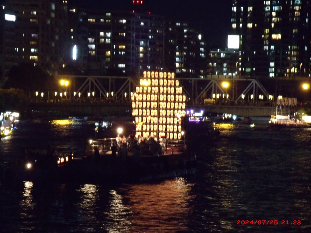 Illuminated festival boats on the Okawa river during Tenjin Matsuri