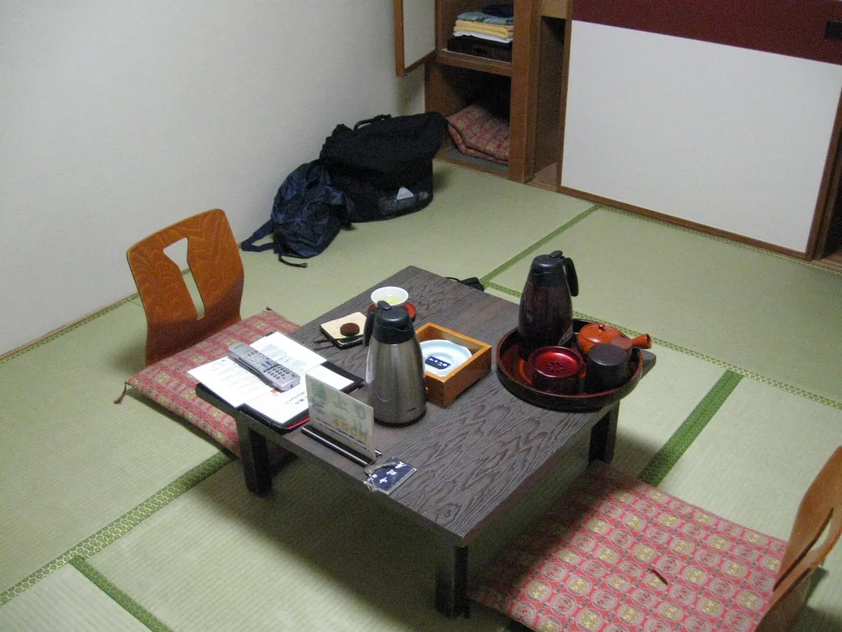 A tatami-floored guest room with low furniture at Hoshinoya Tokyo