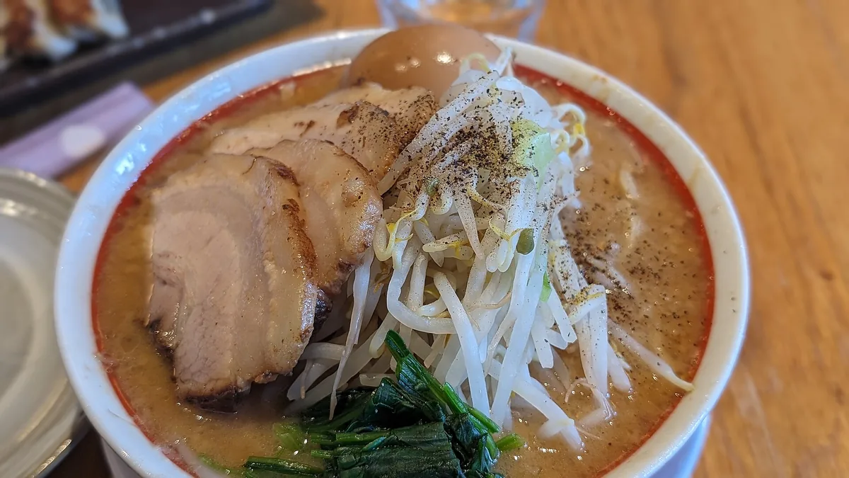 A bowl of sesame tantanmen ramen on a counter at Nakiryu, Tokyo