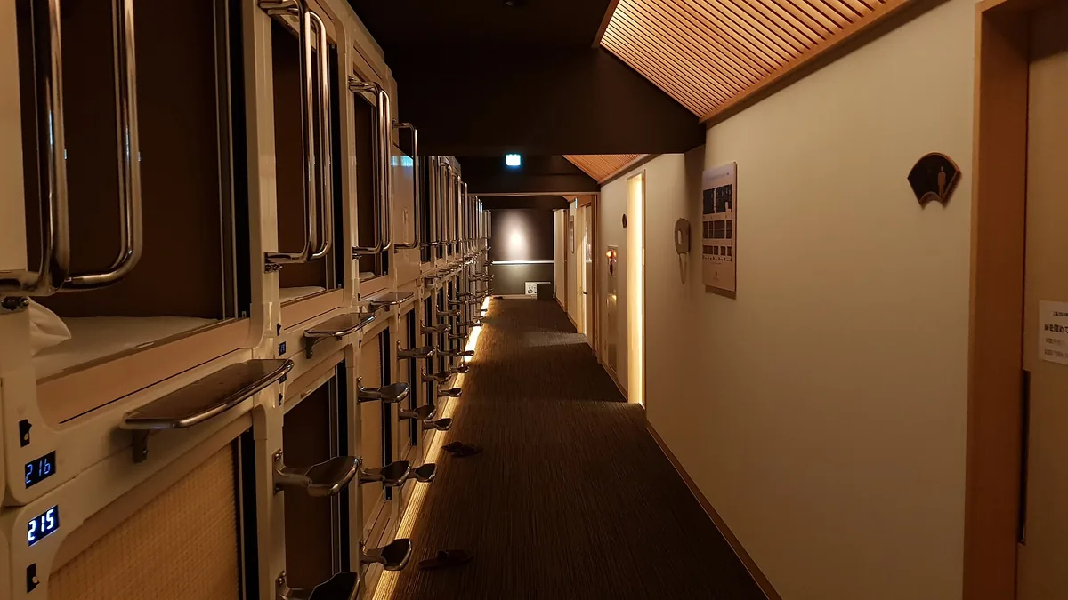 A smart pod with a reclining bed and projector screen at The Millennials Shibuya