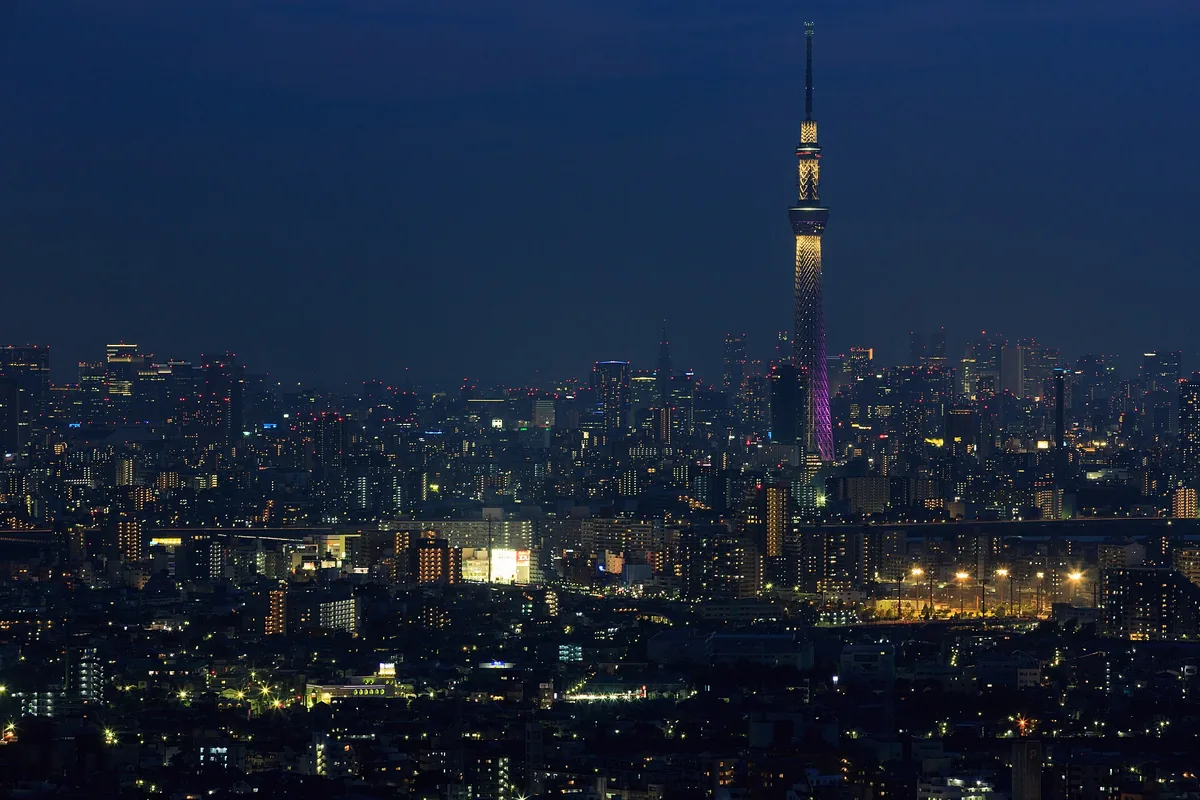 Tokyo Skytree rising above the Sumida district at dusk